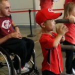 Eli claps at Reds game